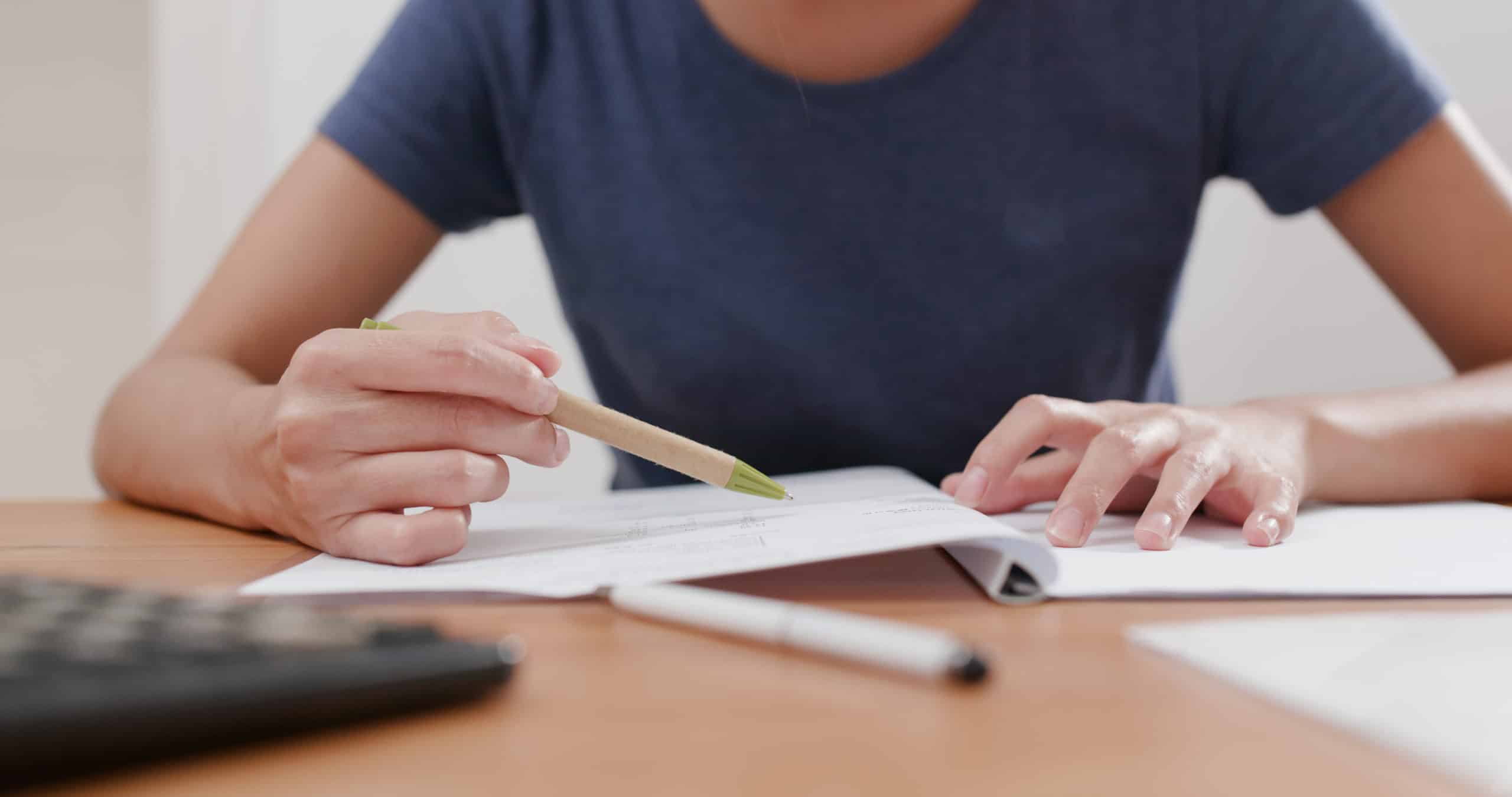 Woman studying on her notebook at homemprove your credit score