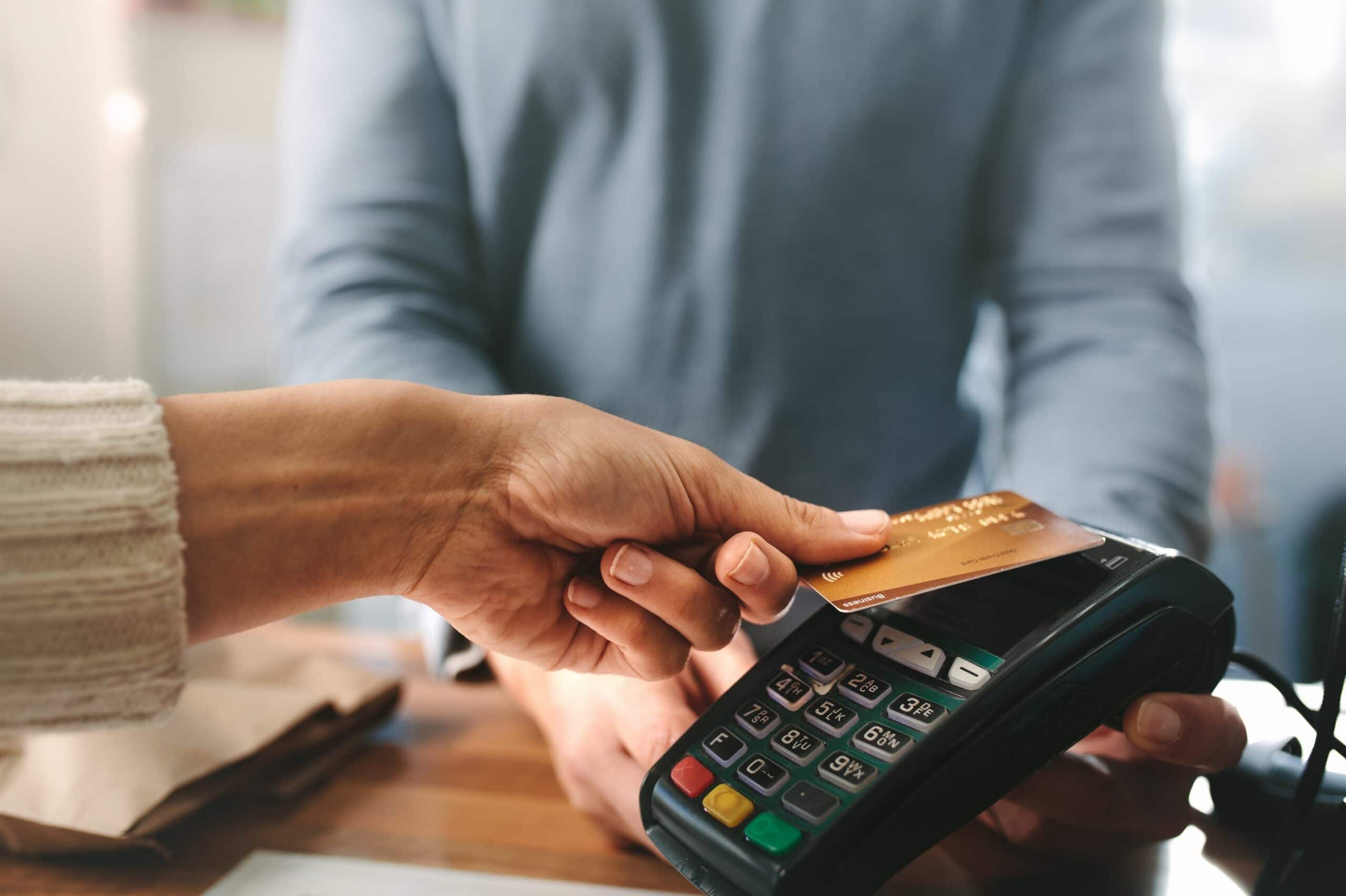 Cropped image of customer paying with credit card.
