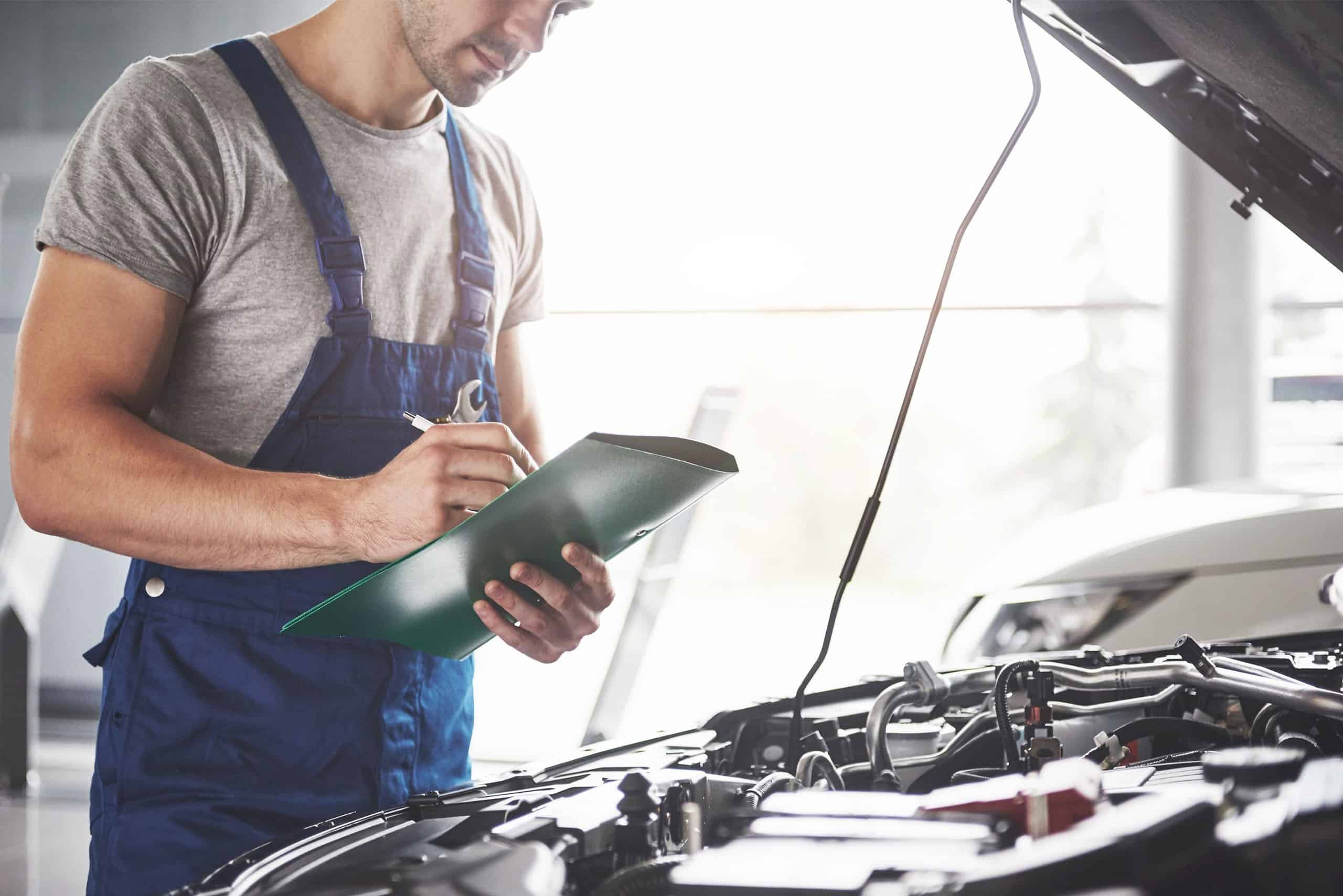 Mechanic going over repairs to be made
