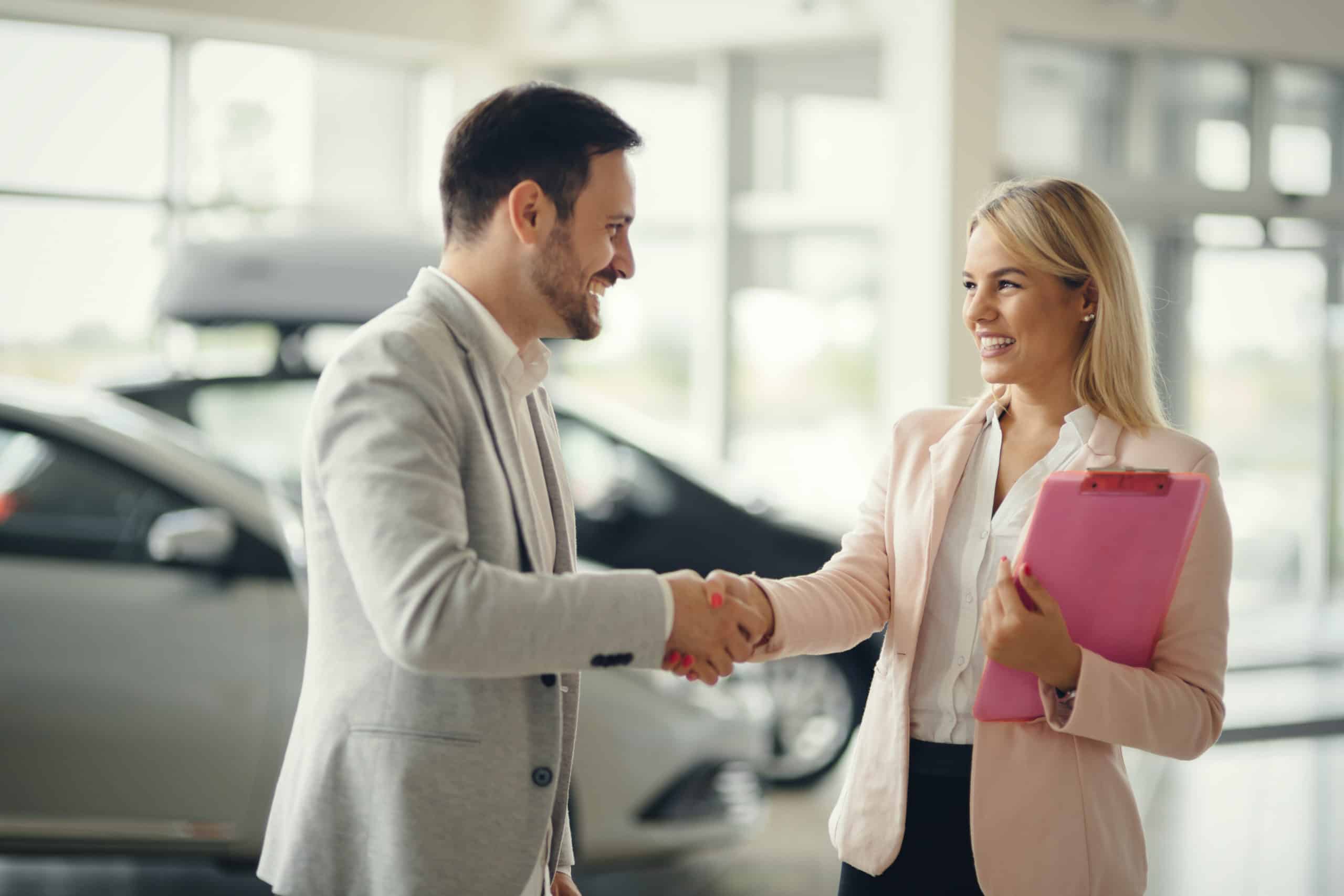 salesperson-workin-at-car-dealership-qdsuz6p-scaled-1