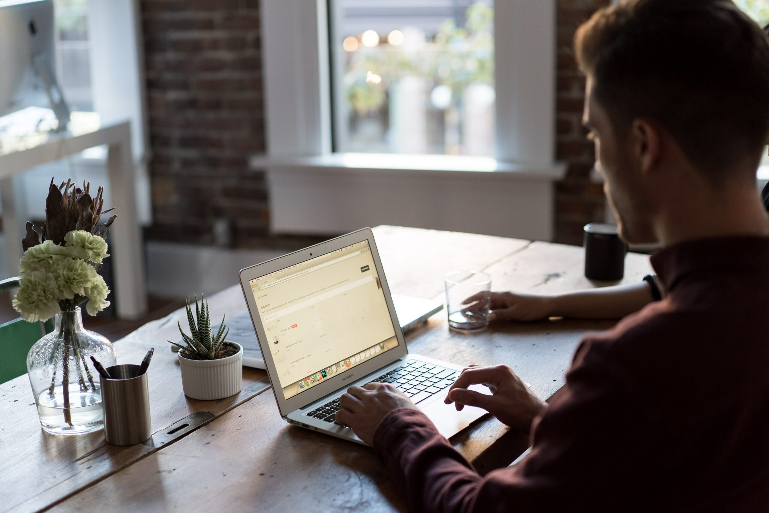 Man on a laptop applying for an unsecured personal loan