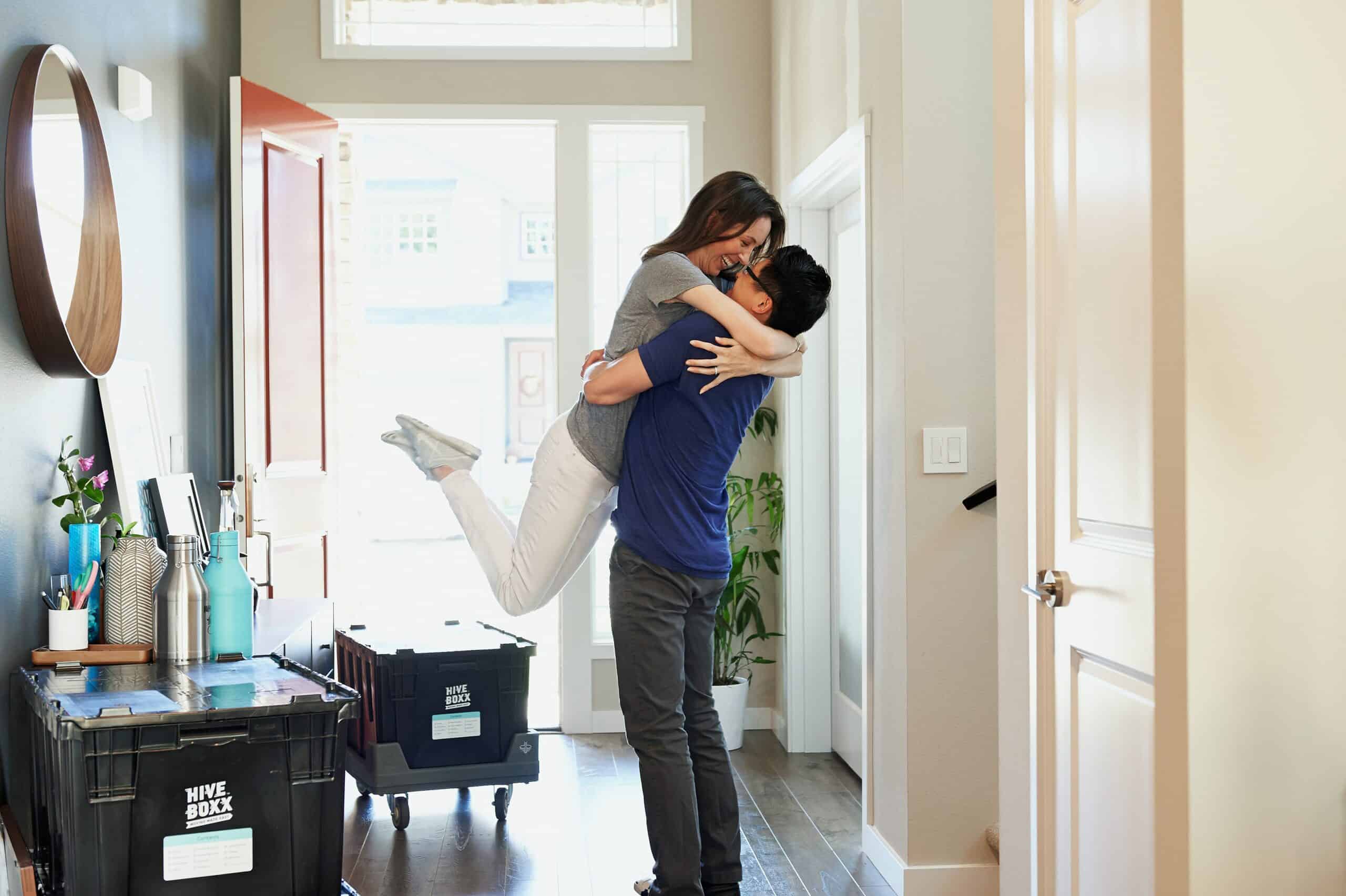 Couple holding each other and celebrating.