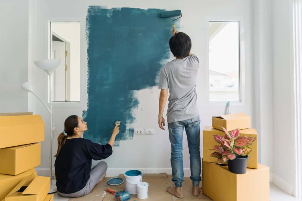 Young couple painting